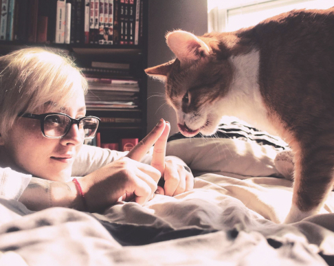 Ash and her orange cat Buddy